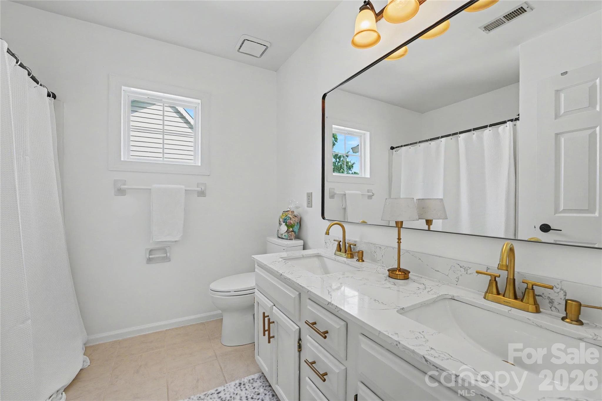 Hall Bathroom with double sinks. - 17205 Asti Court, Cornelius