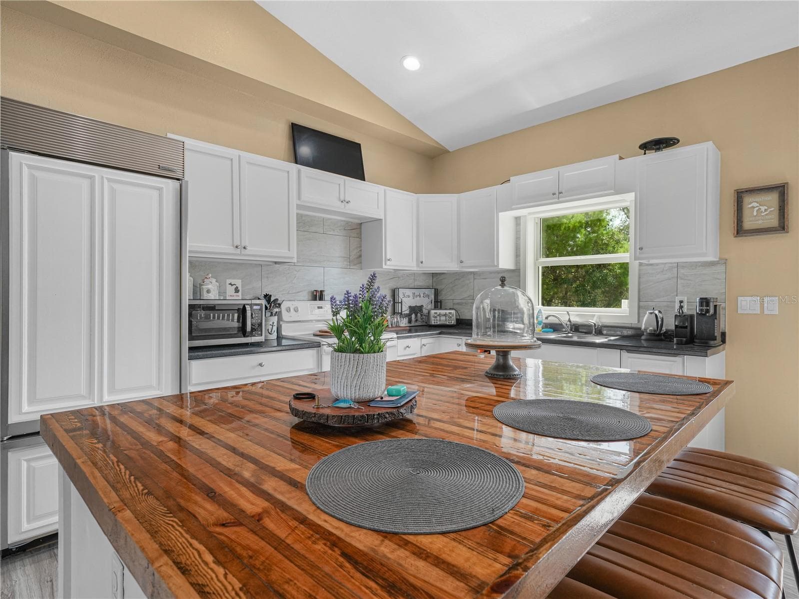 View of kitchen and butcher block island - 10134 S ORANGE BLOSSOM BLVD, SEBRING