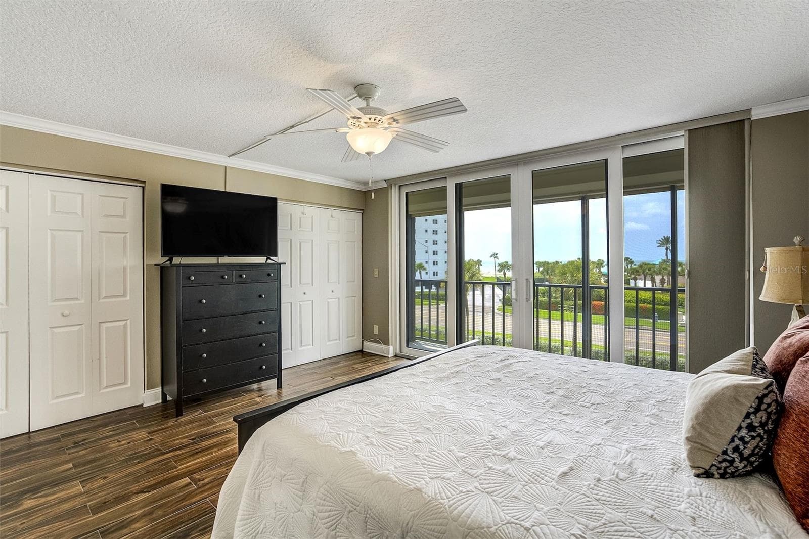 Primary Bedroom With Sliders To Outdoor Balcony - 1581 GULF BLVD #203N, CLEARWATER BEACH