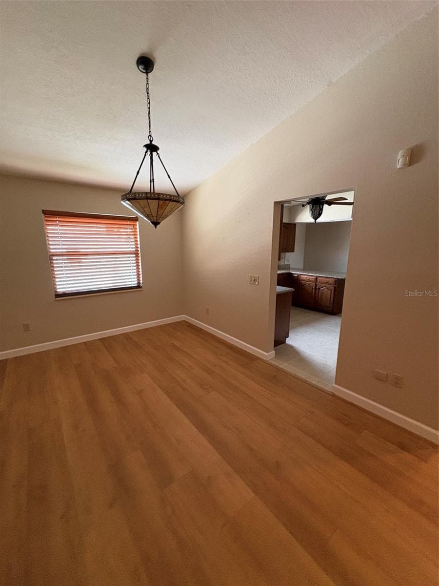 Dining Room into Kitchen - 15810 REDINGTON DR, REDINGTON BEACH
