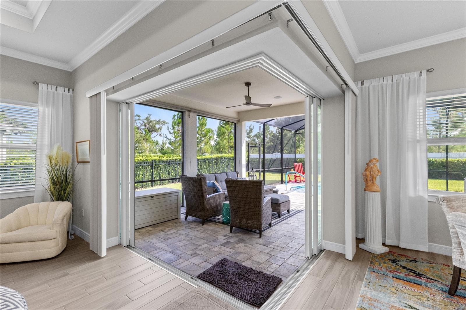 Sliding glass pocket doors lead to back lanai. - 2865 CHERRY BLOSSOM LOOP, ST CLOUD