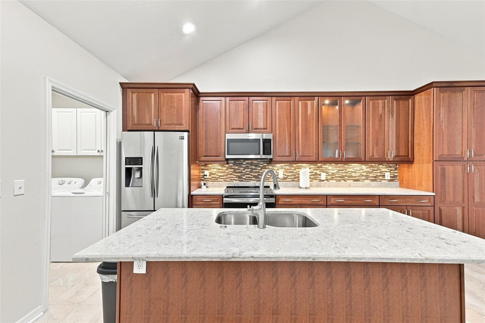 Powered kitchen island is perfect for entertaining and it has a large breakfast bar if desired. - 1124 GOLFVIEW WOODS DR #na, SUN CITY CENTER