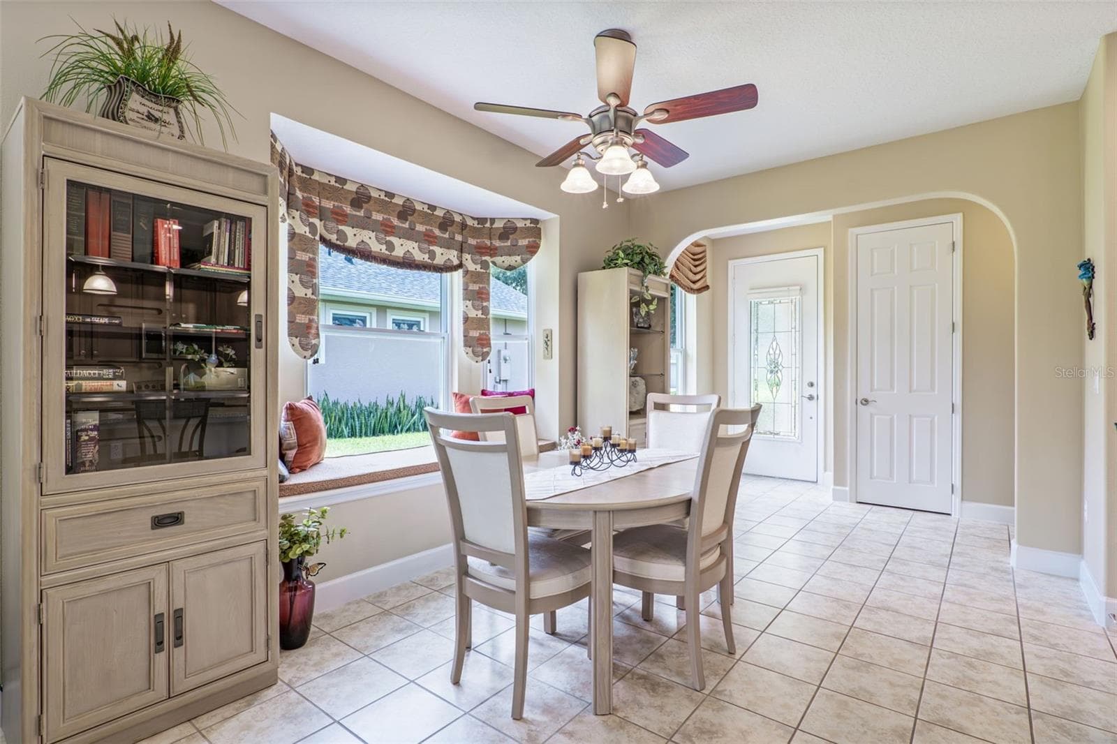 Dining Room w/ a window seat & a ceiling fan - 1381 ABBOT WAY, DELAND