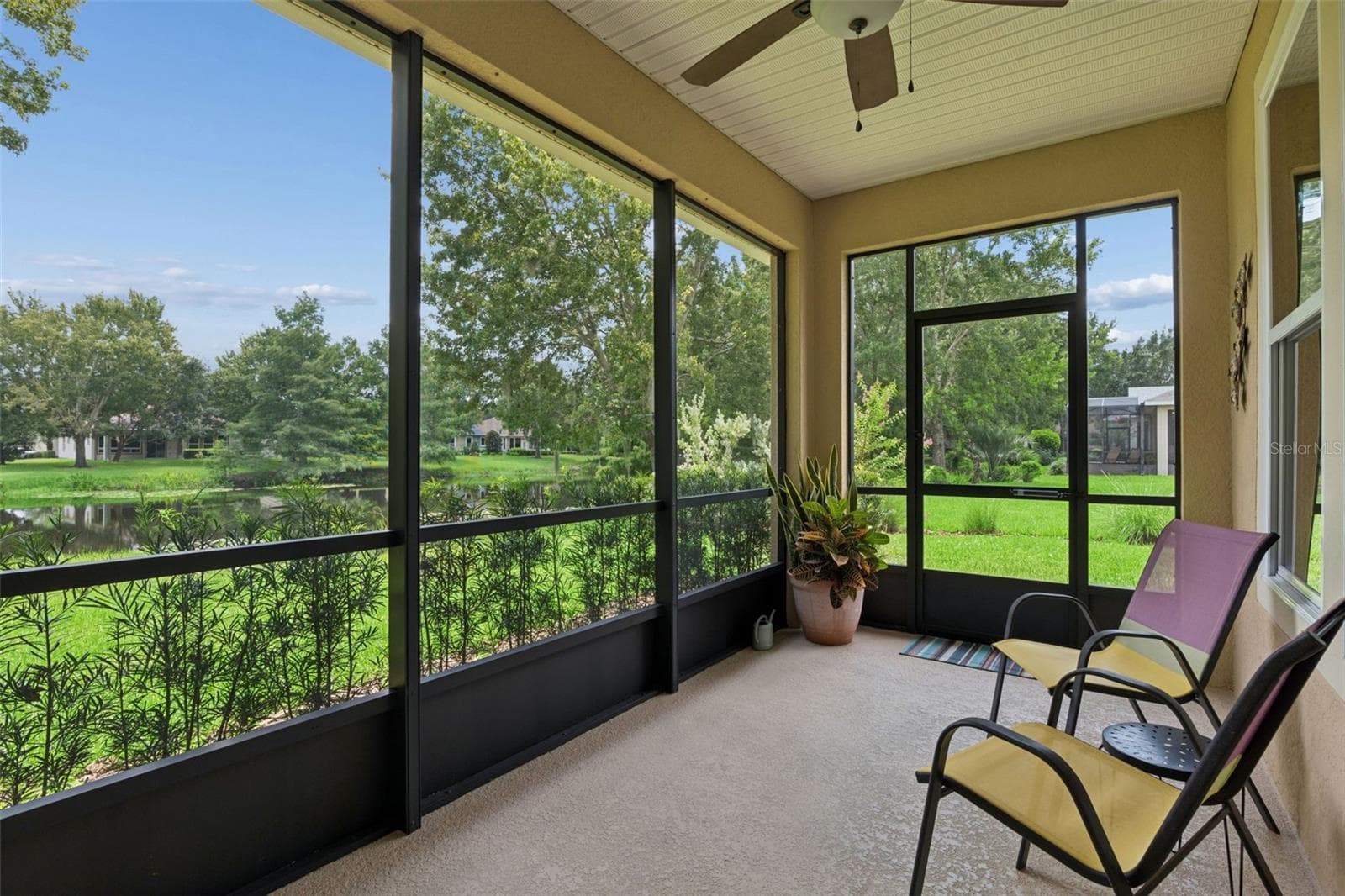 14'6" x 7'9" Screen enclosed covered Lanai w/ a Pond view - 1381 ABBOT WAY, DELAND