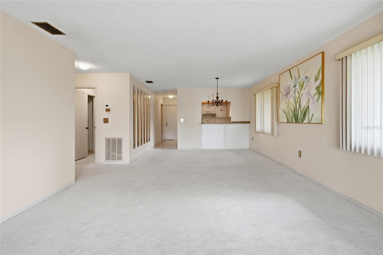 dining room/living room view of kitchen - 3500 EL CONQUISTADOR PKWY #332, BRADENTON