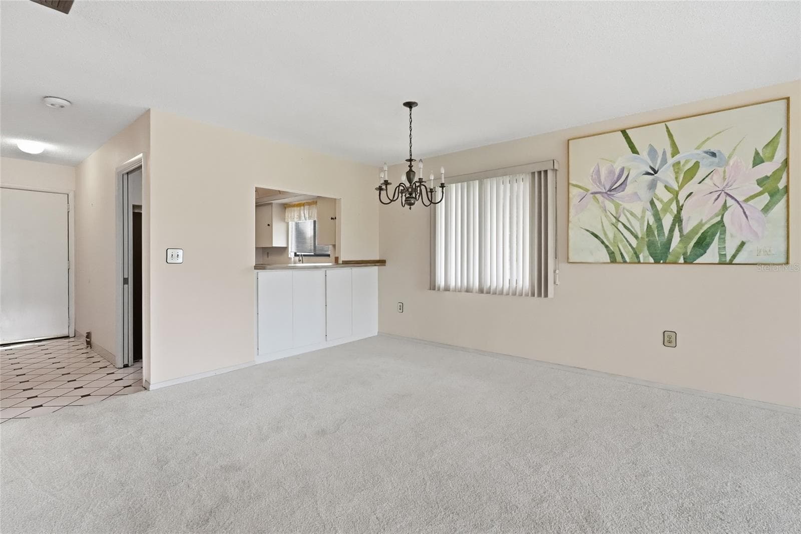 dining room/living room view of kitchen and entry way - 3500 EL CONQUISTADOR PKWY #332, BRADENTON