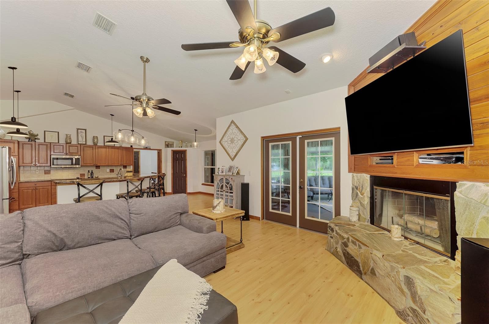 Wood burning fireplace in the living room - 4610 403RD ST E, MYAKKA CITY