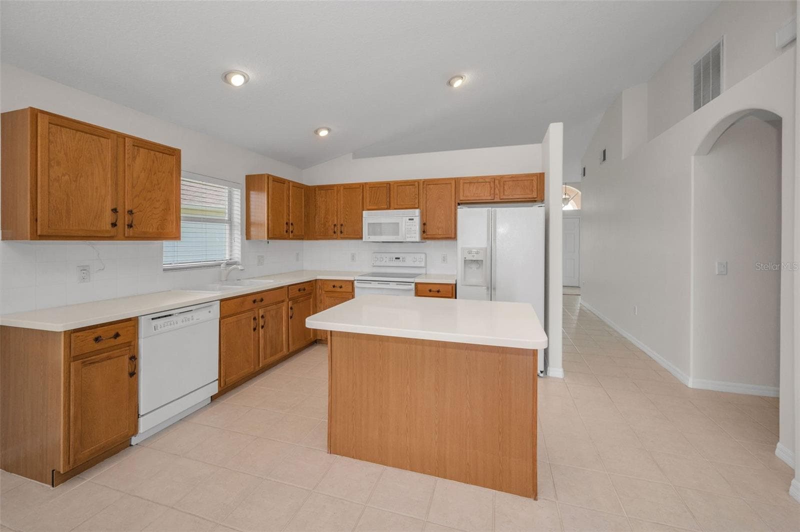 KITCHEN WITH WOOD CABINETS - 12021 FERN TERRACE CT, TRINITY