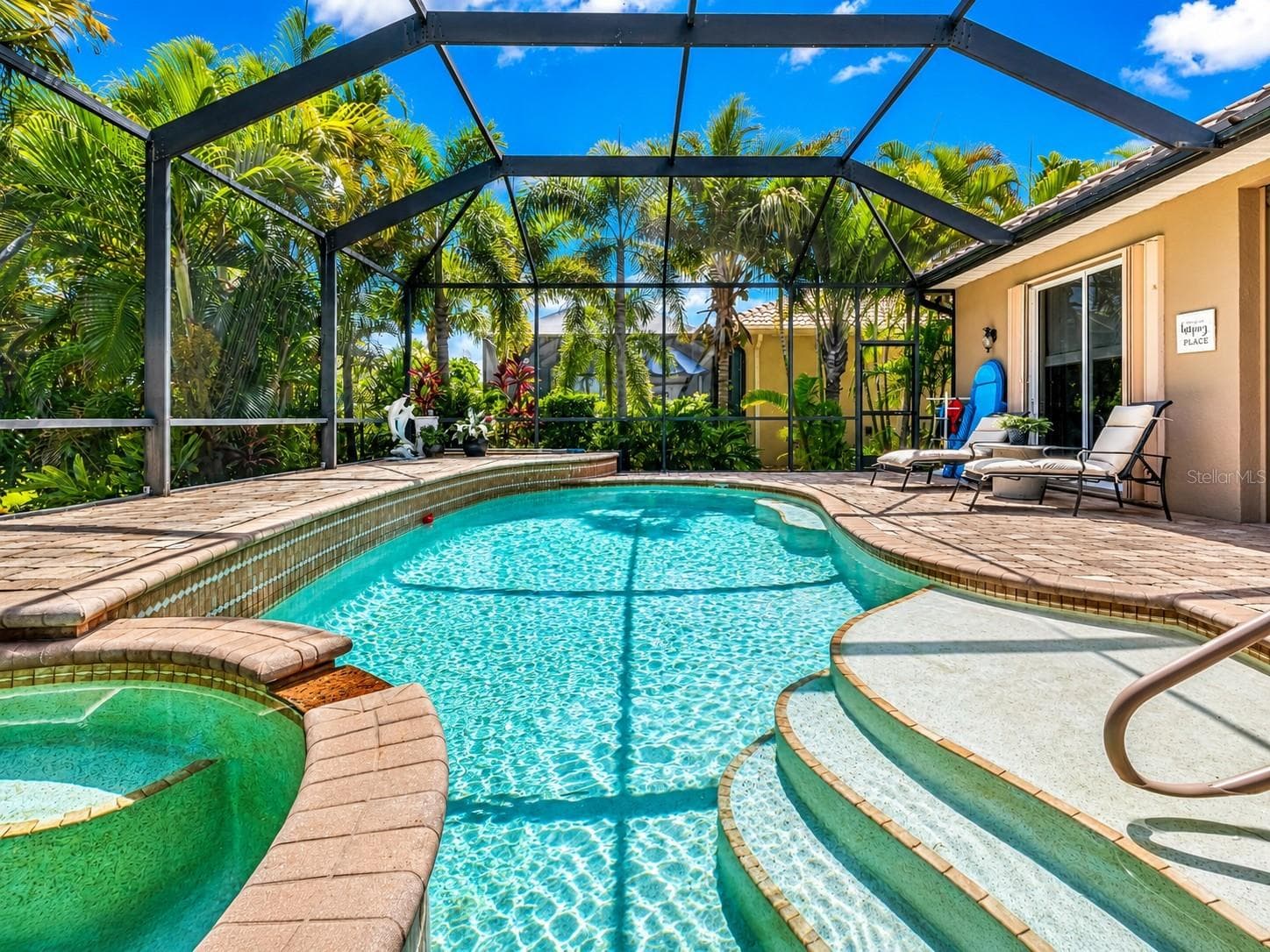 Slip into vacation mode—sunshine, sparkling water and tropical surroundings await. - 24228 PEPPERCORN RD, PUNTA GORDA