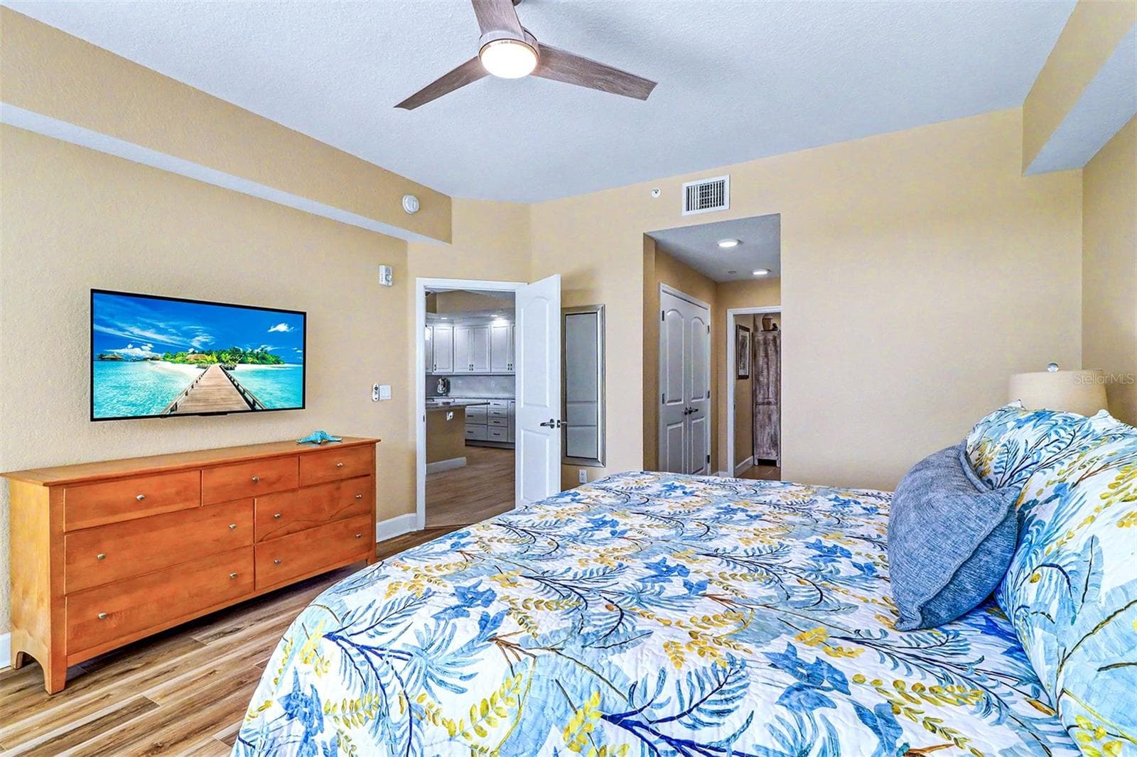 ..MASTER SUITE LOOKING OUT TOWARDS LIVING ROOM AREA AND KITCHEN. - 19519 GULF BLVD #202, INDIAN SHORES