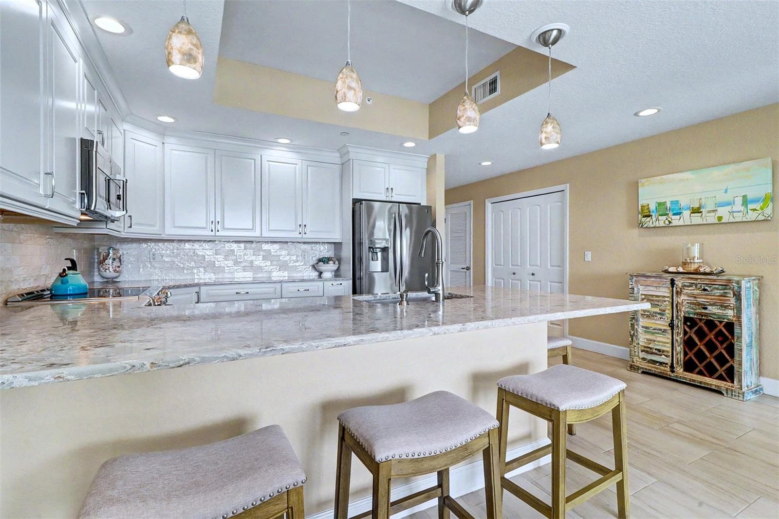 .. KITCHEN SHOT #2.. KraftMaid 42" Cabinetry with Pearlized Subway Tile Back splash. Open Flooplan from Kitchen Out. - 19519 GULF BLVD #202, INDIAN SHORES