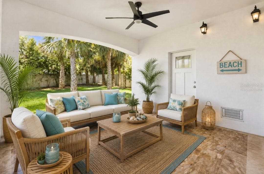 Virtually staged first floor covered porch with access to the backyard - 1956 CEDAR DR, DUNEDIN