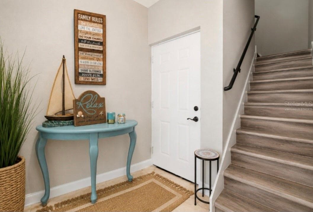 Foyer and access to the garage - 1956 CEDAR DR, DUNEDIN