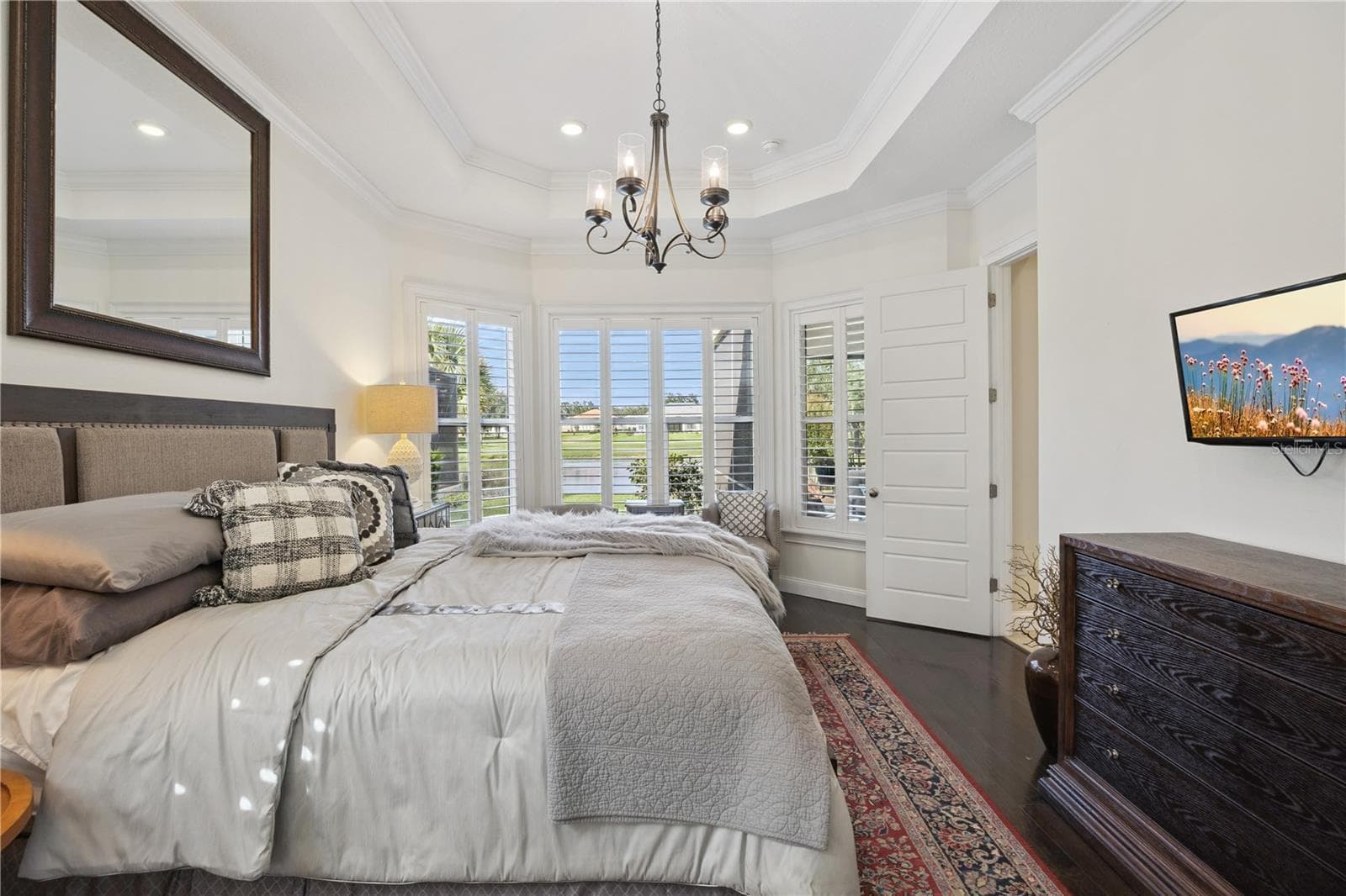 Stunning Master bedroom with views of the pond. - 9219 SAN JOSE BLVD, HOWEY IN THE HILLS