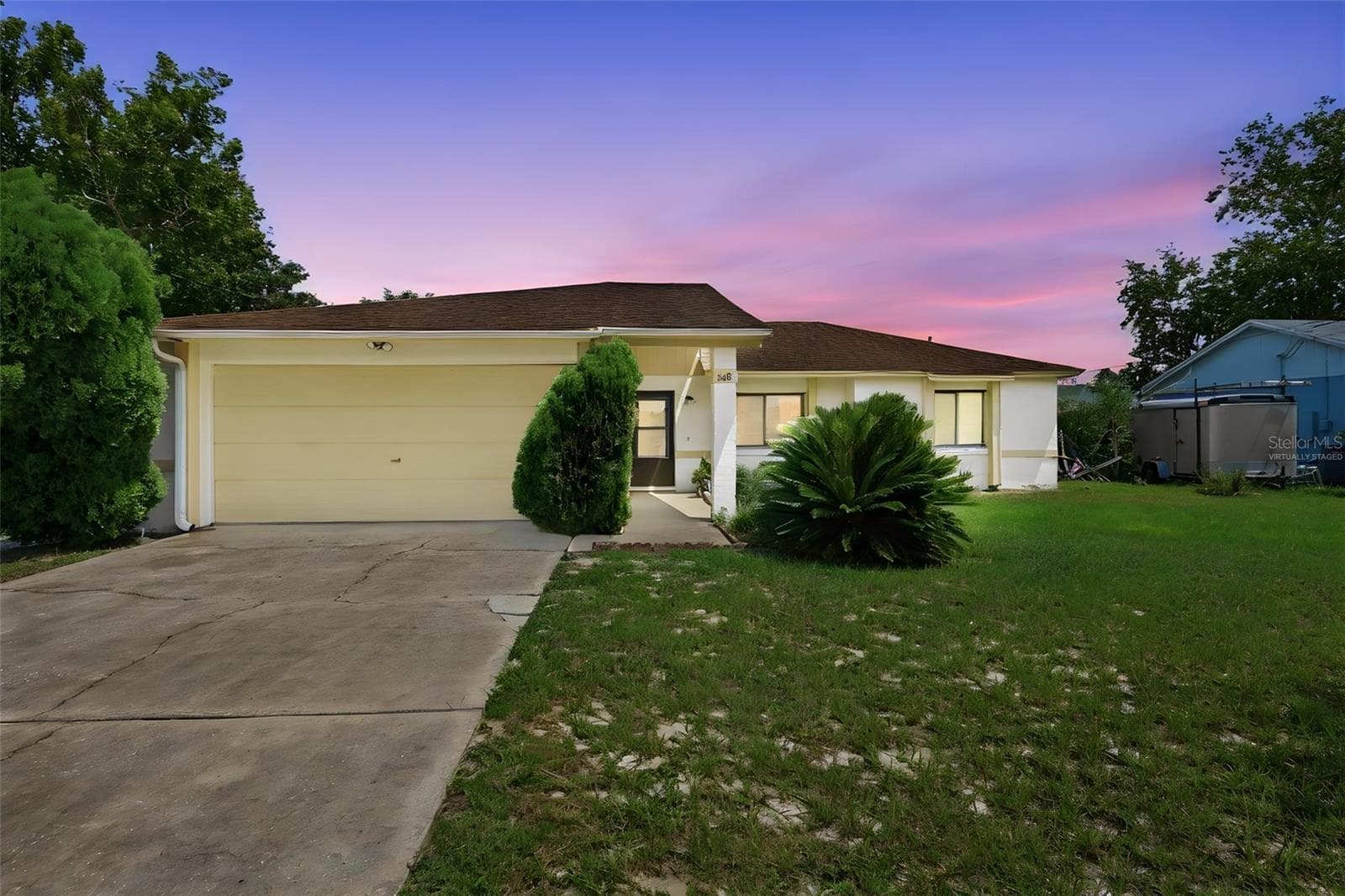 Virtually staged dusk exterior - 1418 CATALINA BLVD, DELTONA