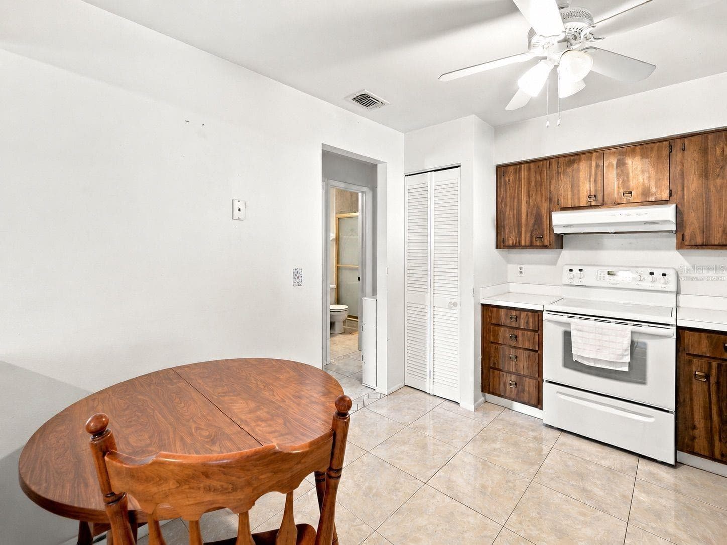 Virtually staged kitchen - 1418 CATALINA BLVD, DELTONA