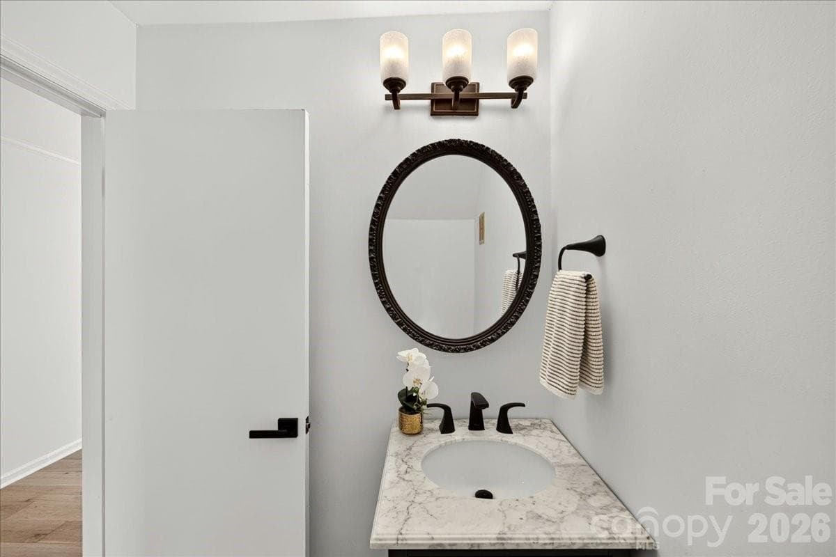 The powder room just off the kitchen and living room - 3500 Colony Road, Charlotte