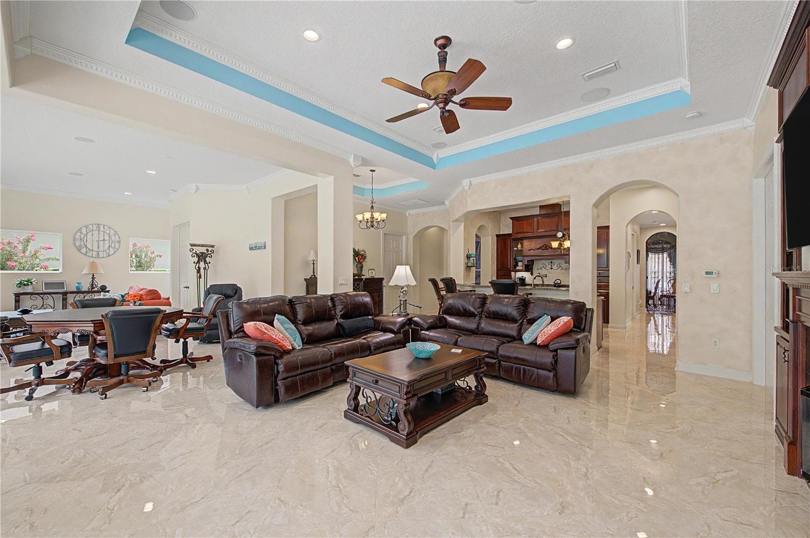 Expansive Family Room with view of Beautiful Pool Oasis, Backyard and Lake - 21246 QUIET HAVEN CT, LAND O LAKES