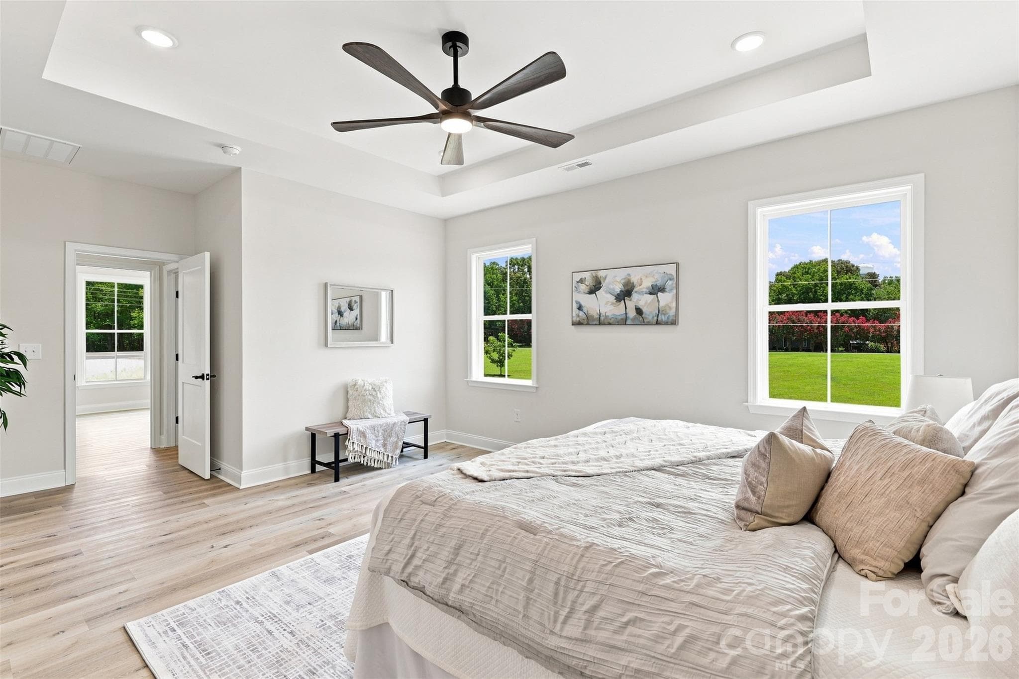 primary bedroom w/ tray ceiling, ensuite full bath, & WIC - 390 NC 200 Highway S, Stanfield