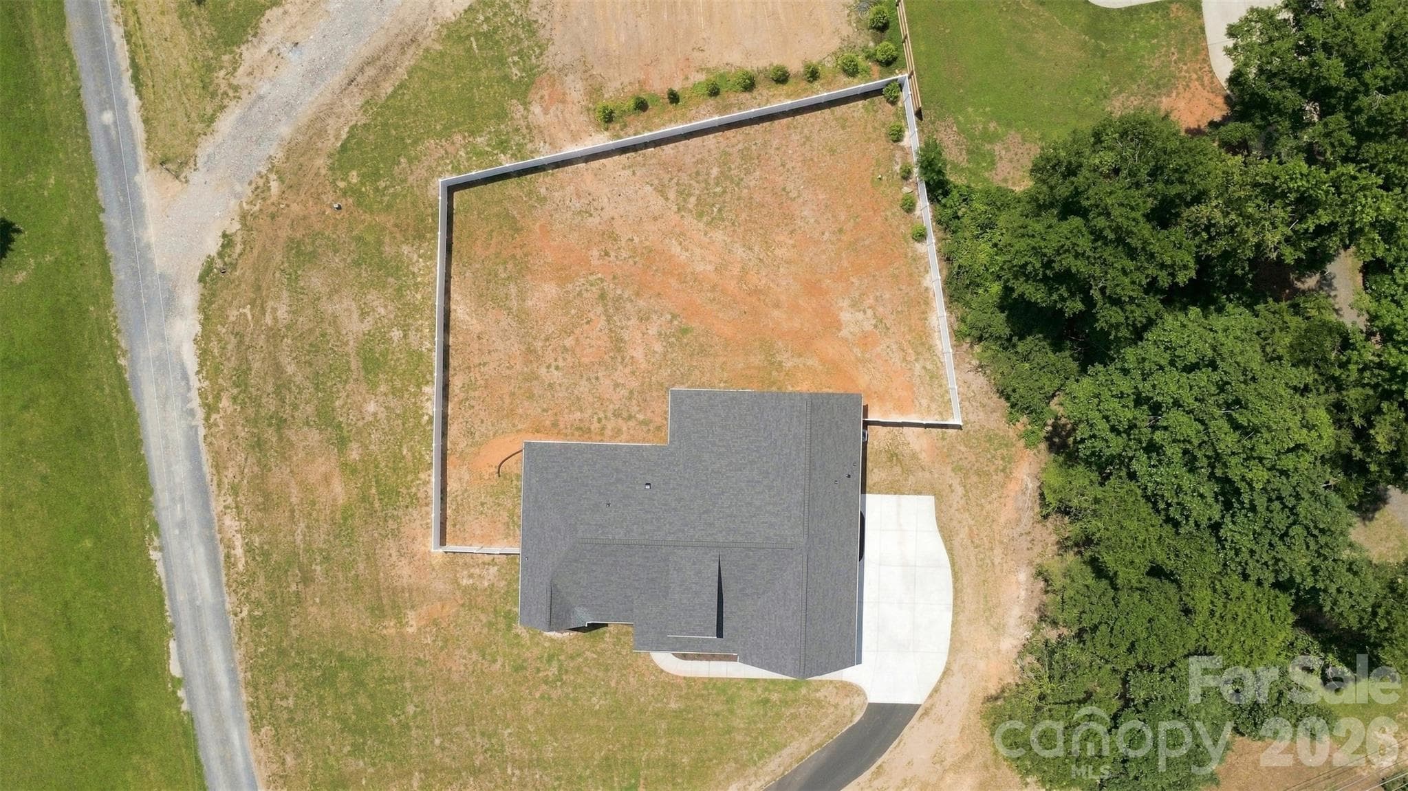 backyard w/ privacy fence - 390 NC 200 Highway S, Stanfield