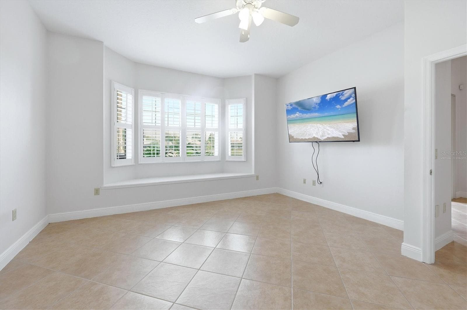 image on tv virtually staged - 8434 MIRAMAR WAY, LAKEWOOD RANCH