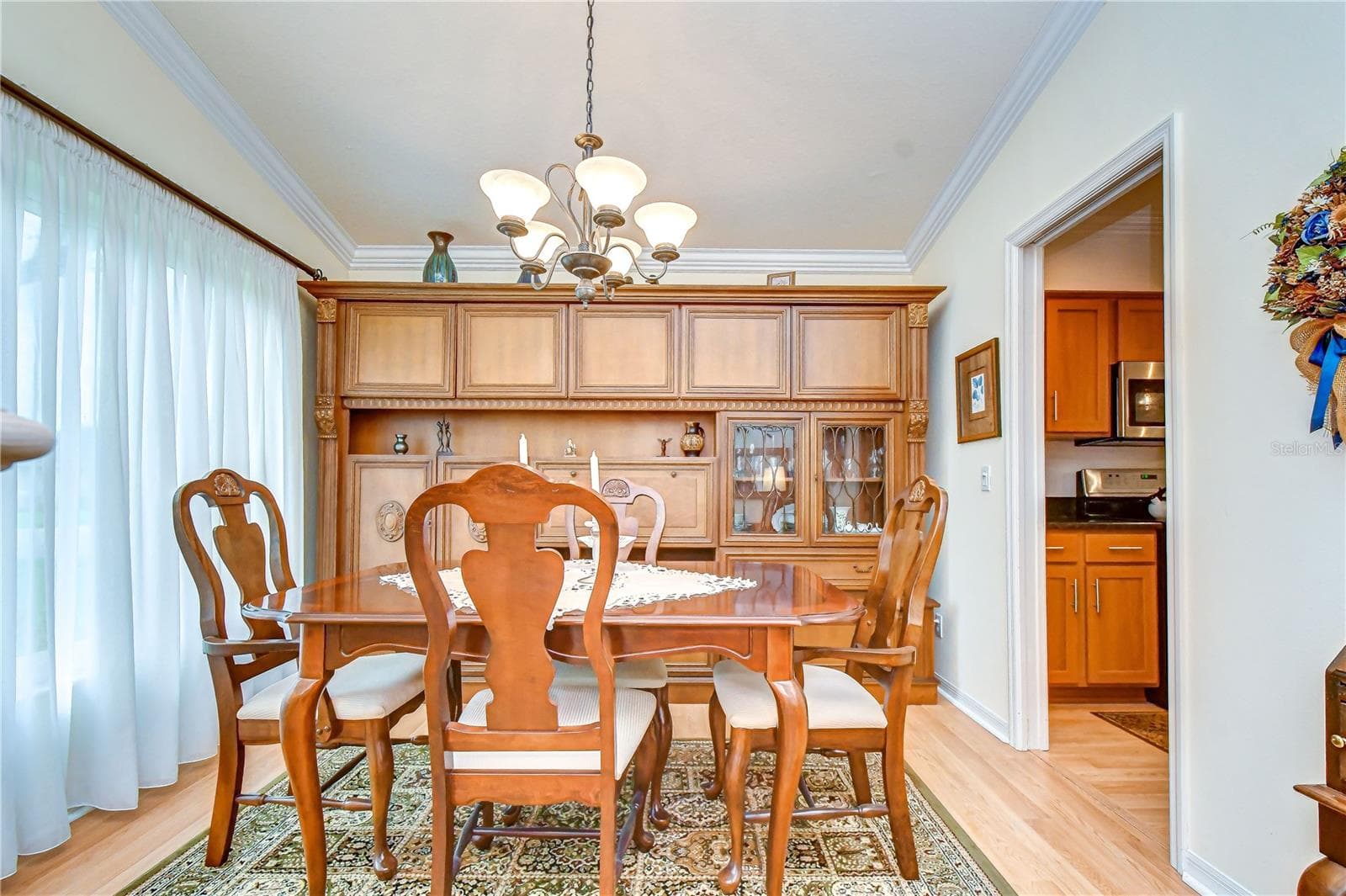 Elegant dining space filled with natural light, perfect for holiday gatherings and dinner parties. - 5602 ROCKFIELD LOOP, VALRICO