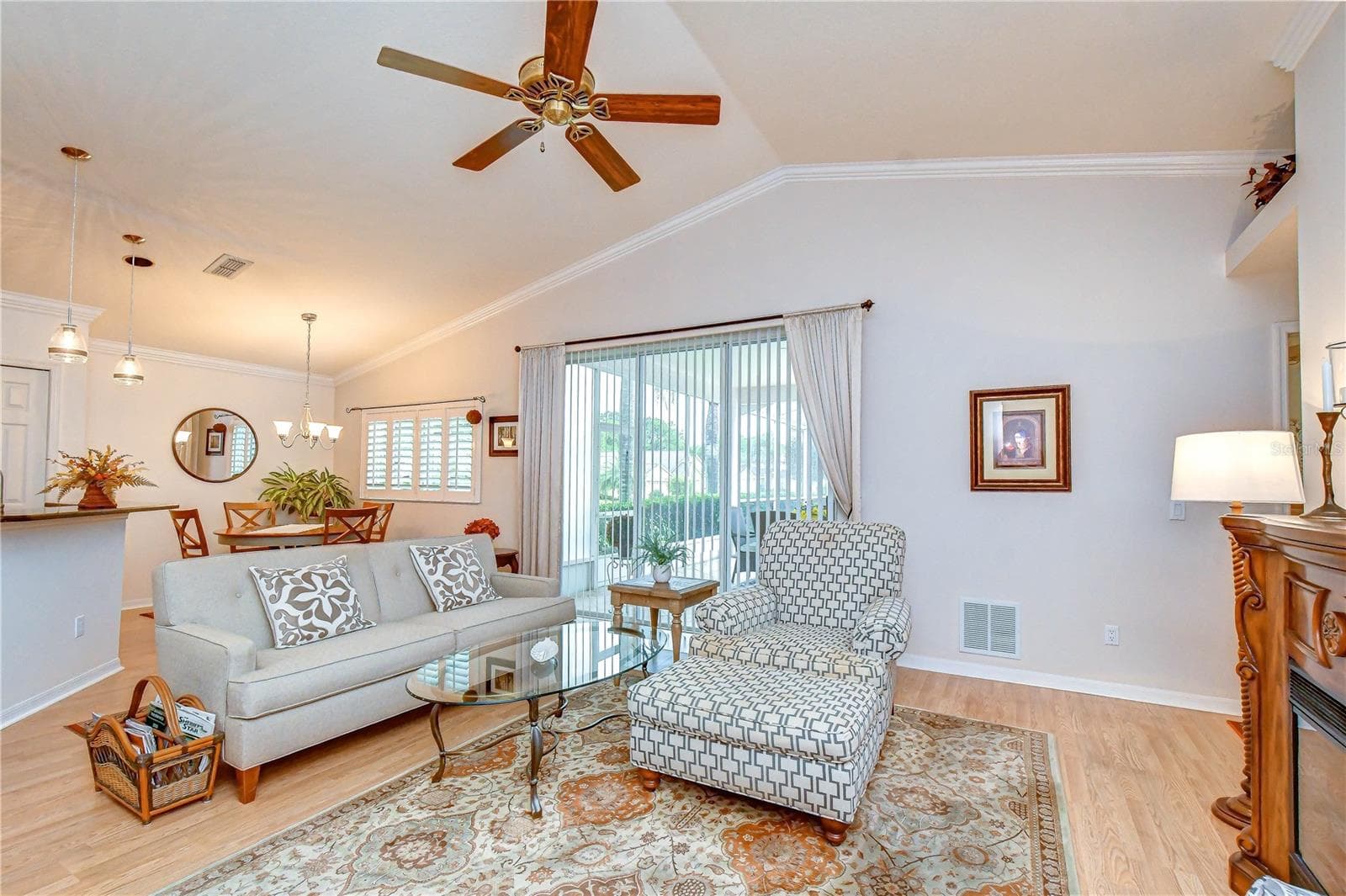 Large sliding doors seamlessly connect the family room to the screened lanai and pool. - 5602 ROCKFIELD LOOP, VALRICO