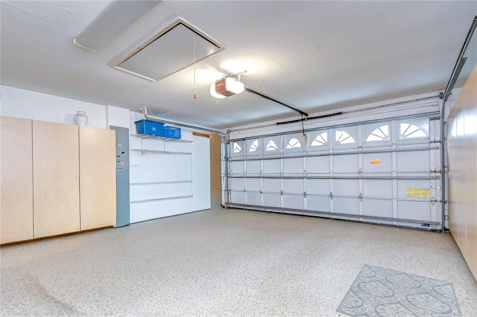 Functional two-car garage providing secure parking and additional storage capability. - 5602 ROCKFIELD LOOP, VALRICO