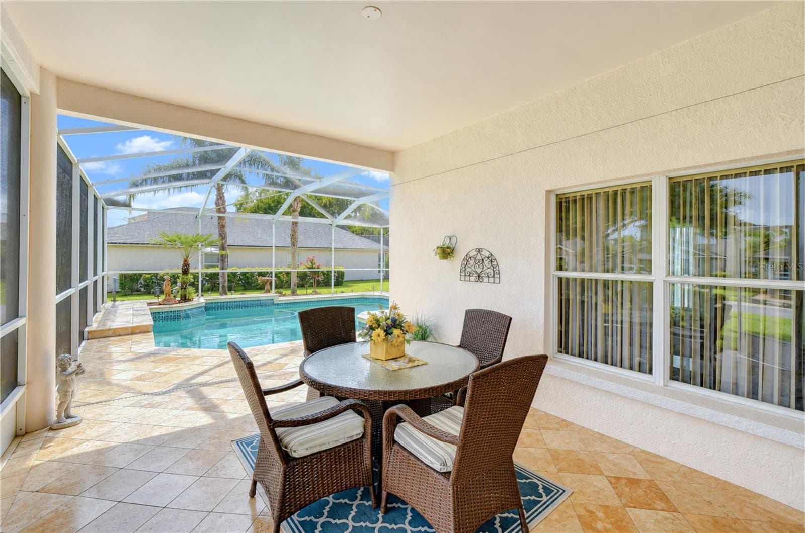 Comfortable covered outdoor living space ideal for relaxing, dining, or entertaining. - 5602 ROCKFIELD LOOP, VALRICO