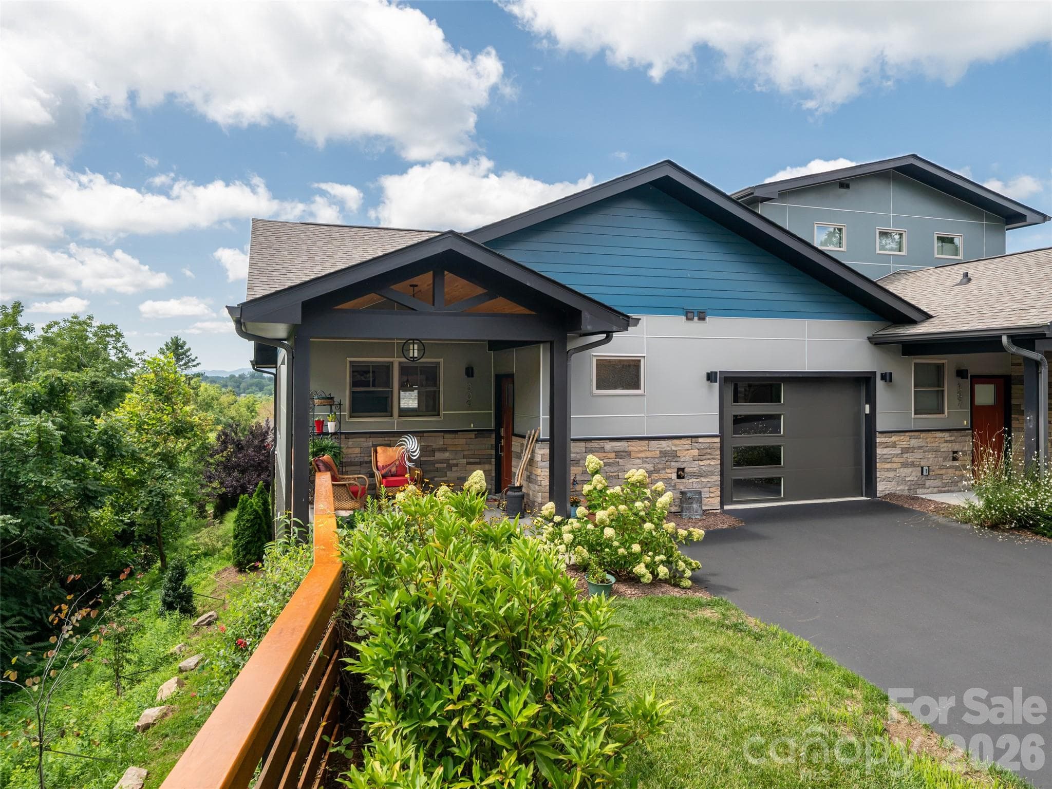 Lovely front yard area allowing for personal gardening. - 309 Ava Lane, Asheville