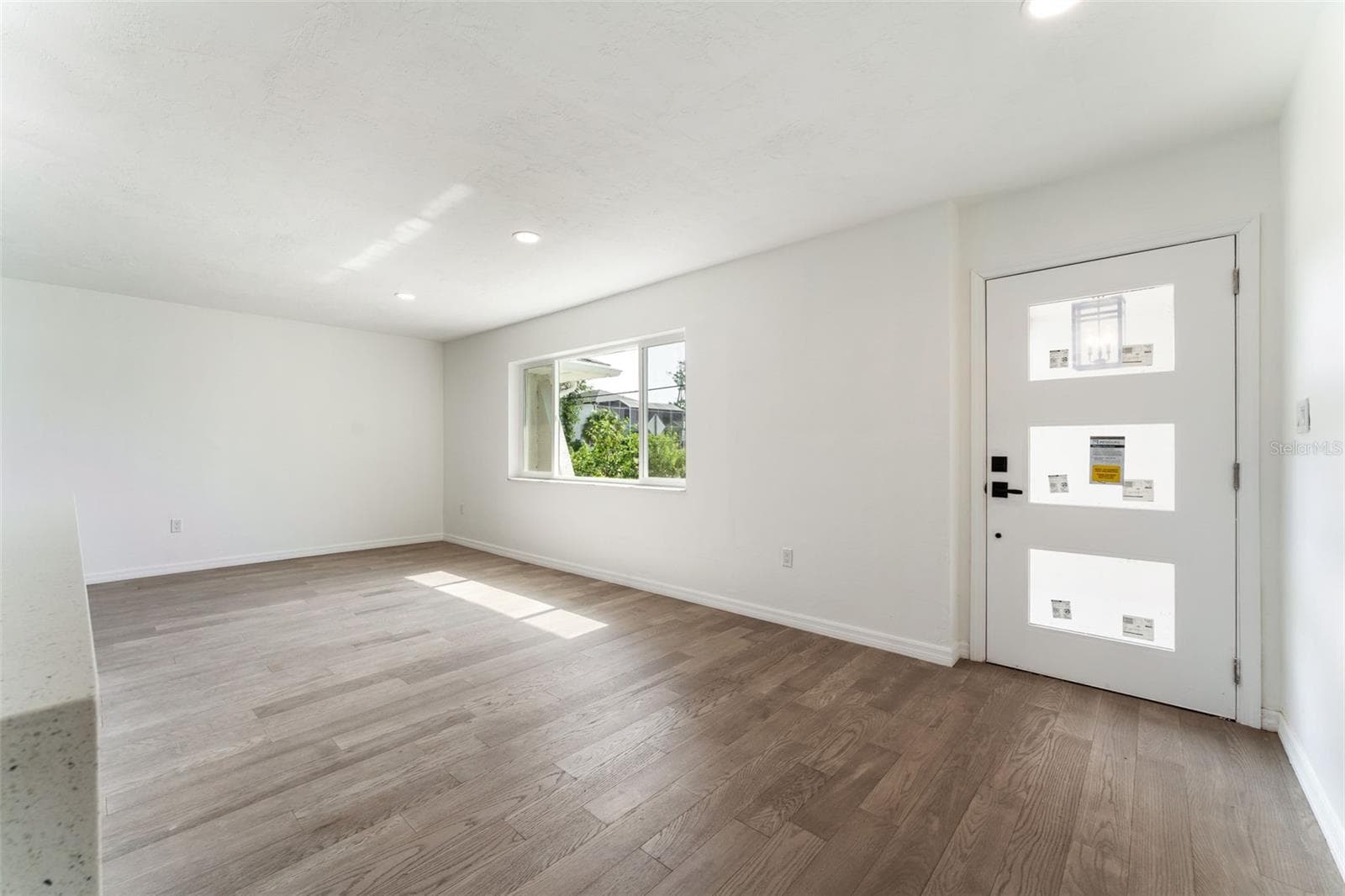 Front Door living/dining room area - 1231 BEACON DR, PORT CHARLOTTE