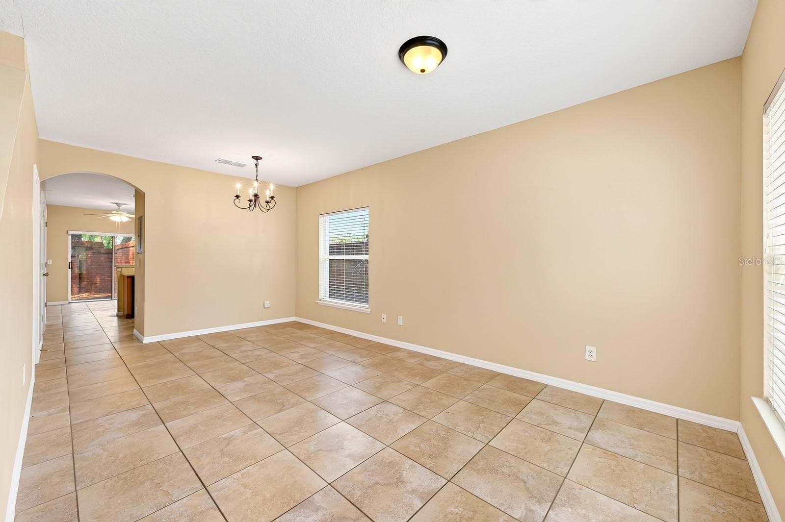 Open living and dining. - 102 WILTON CIR, SANFORD