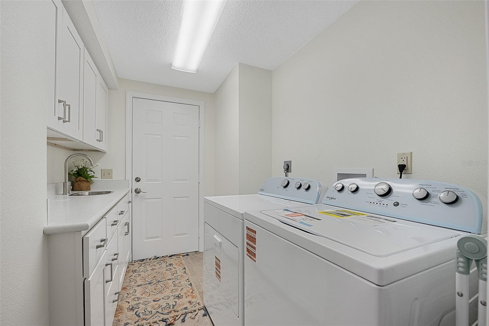 Laundry room with brand new W/D and cabinets - 1 CROOKED BRIDGE WAY, ORMOND BEACH