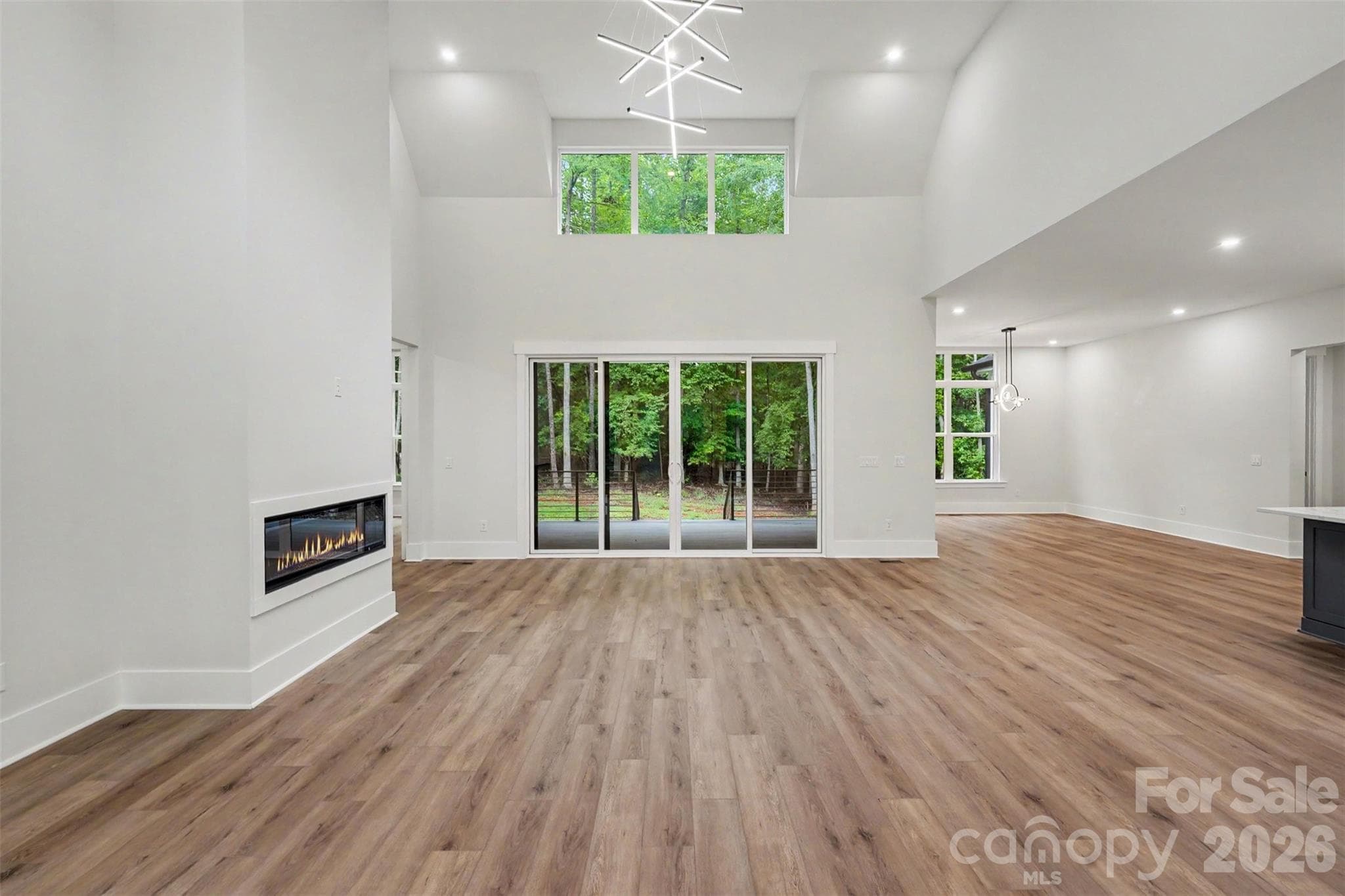 Living room with stunning architectural design, windows and natural light - 4808 Rockwood Drive, Waxhaw