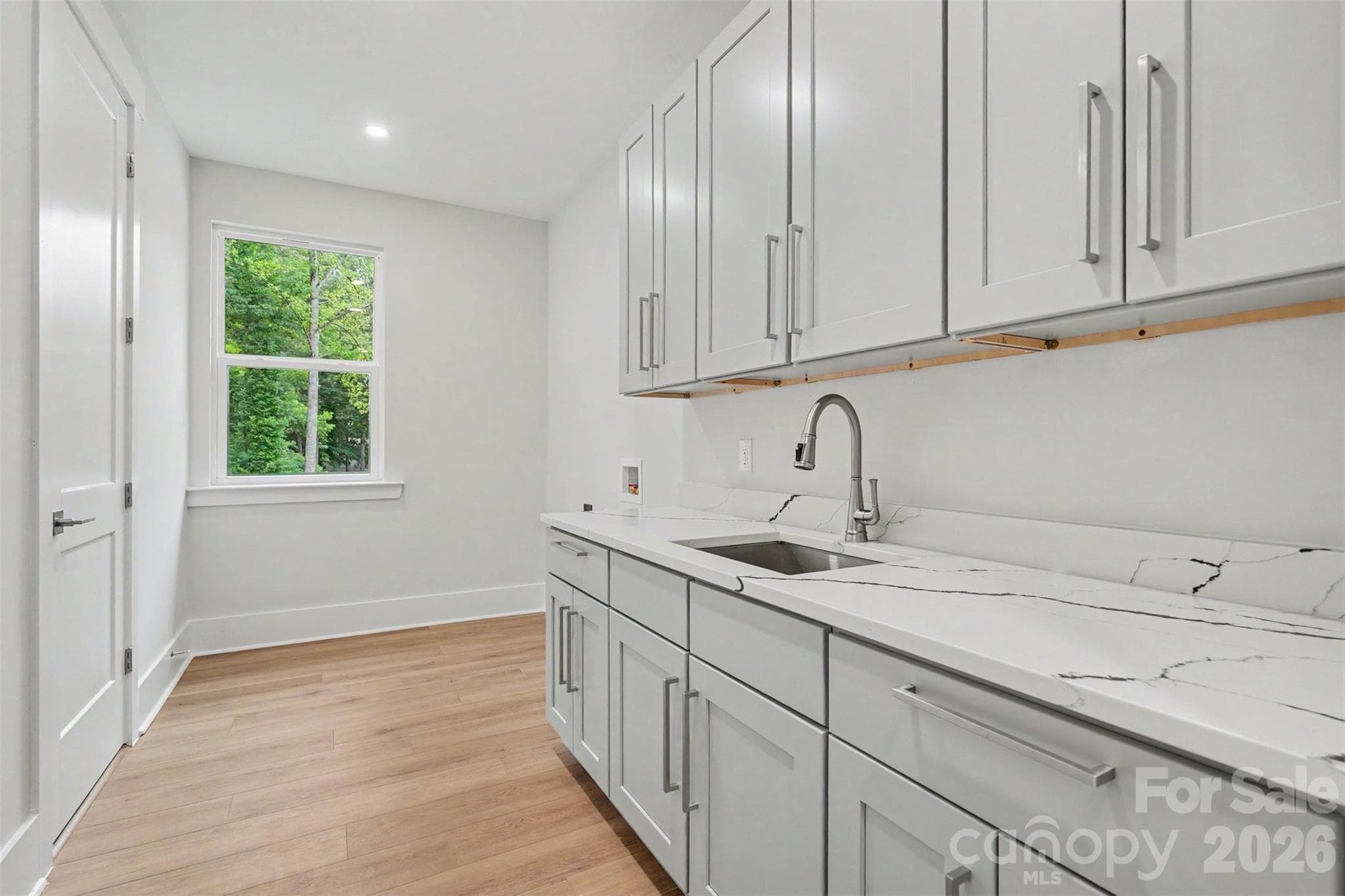 Laundry Room, easily accesible through primary closet area - 4808 Rockwood Drive, Waxhaw