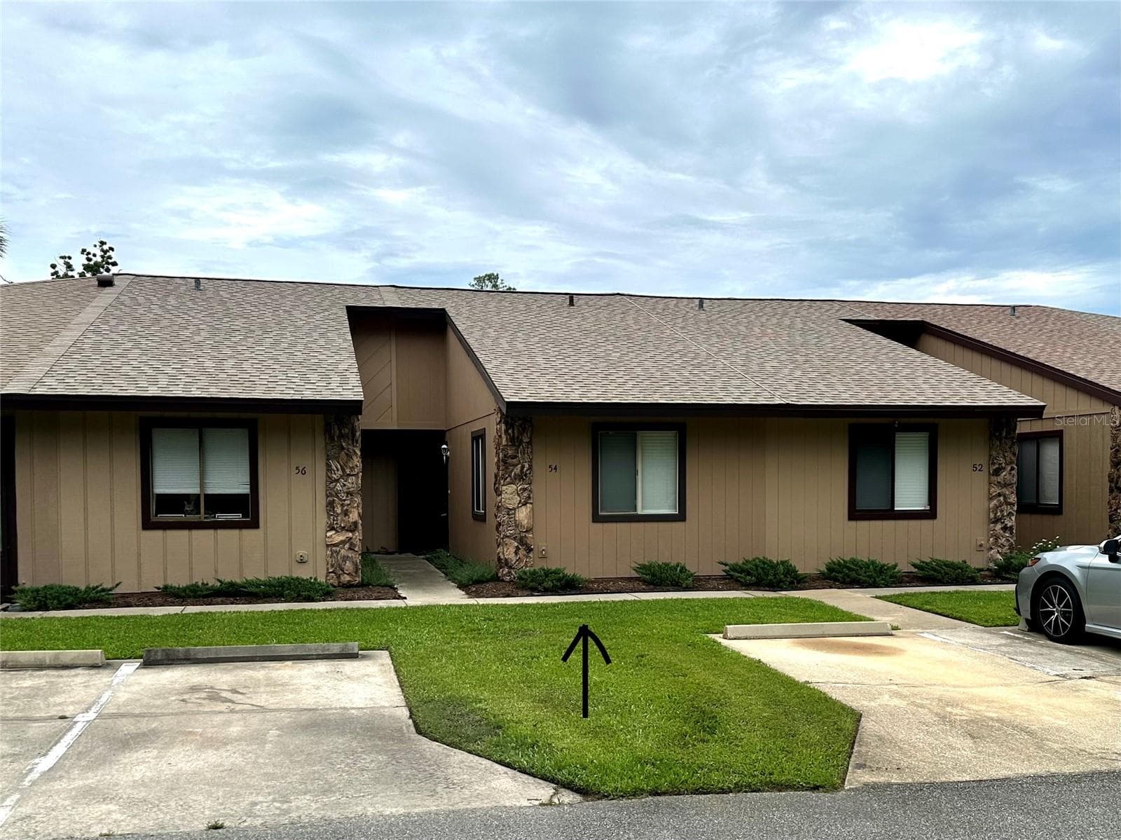 your parking space in front of condo - 54 FOREST RD #54, FLAGLER BEACH