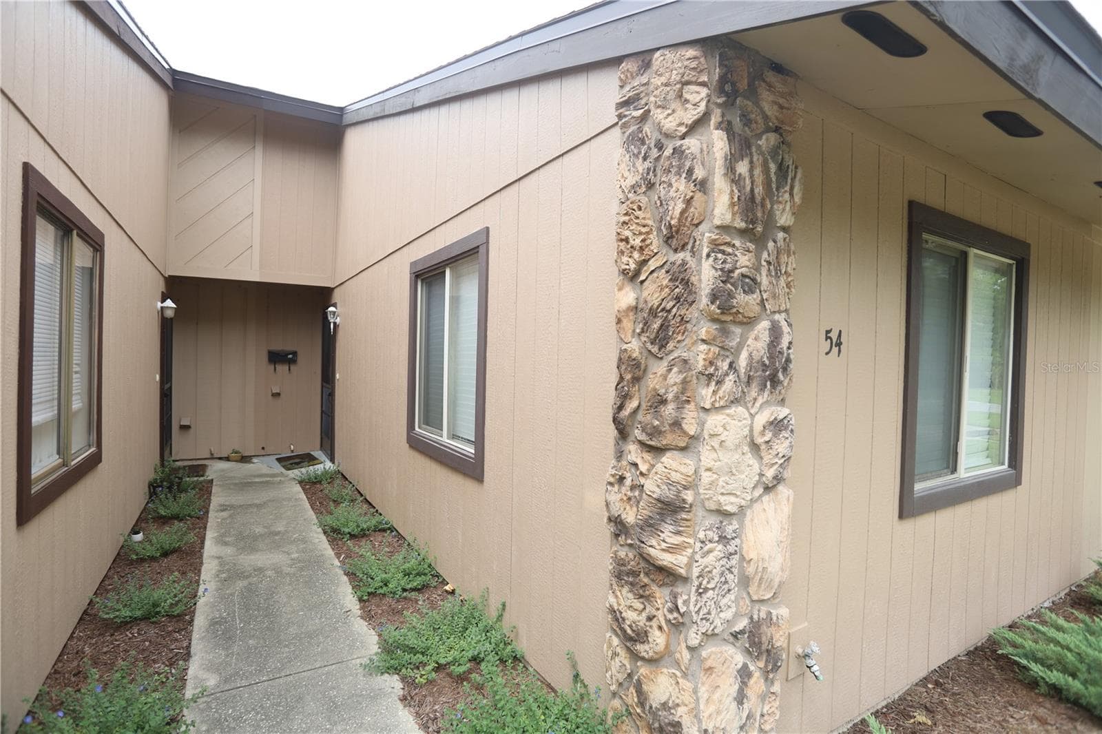 Walkway to front door - 54 FOREST RD #54, FLAGLER BEACH
