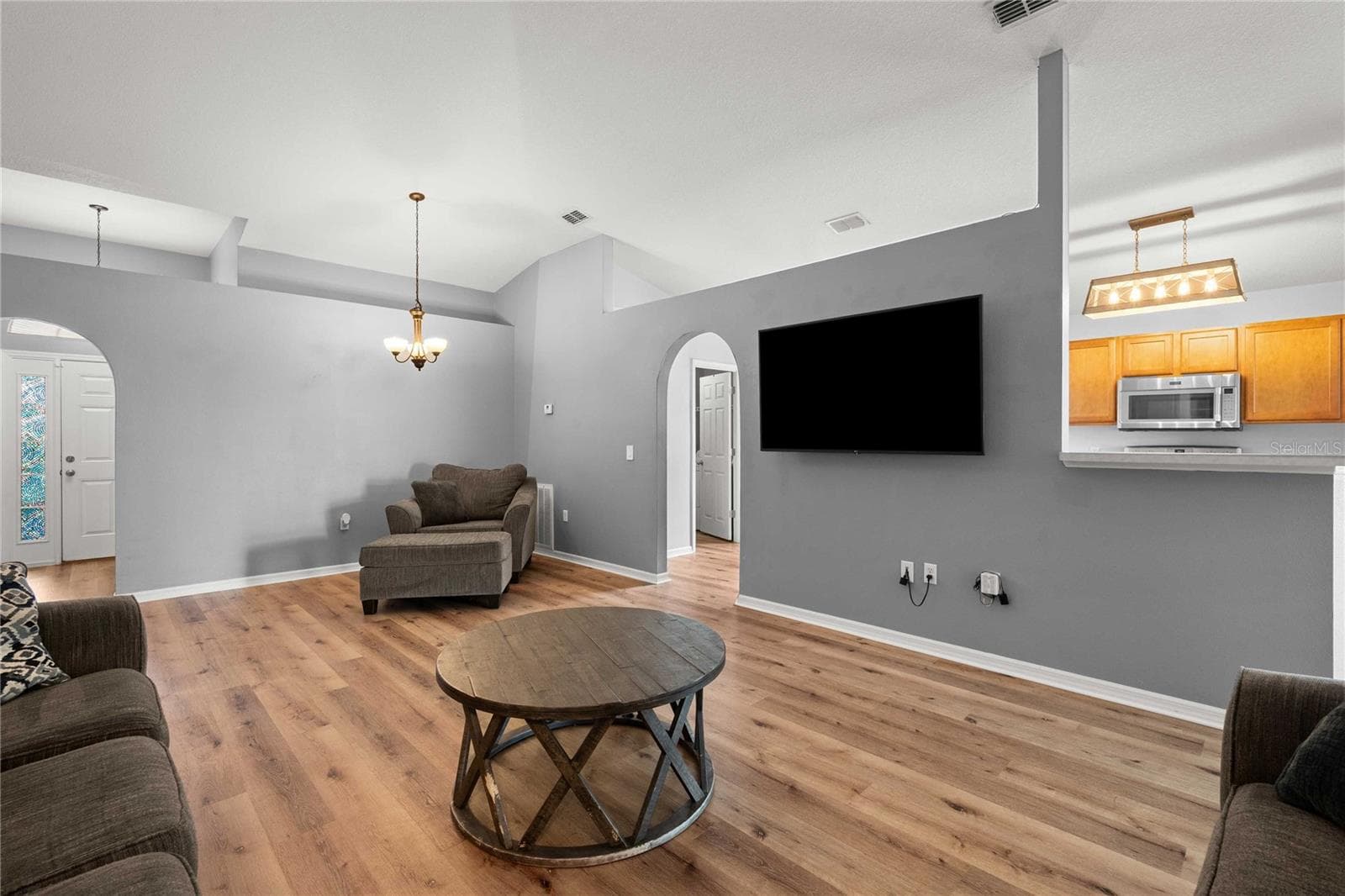 Living room with view into Kitchen - 14423 FINSBURY DR, SPRING HILL