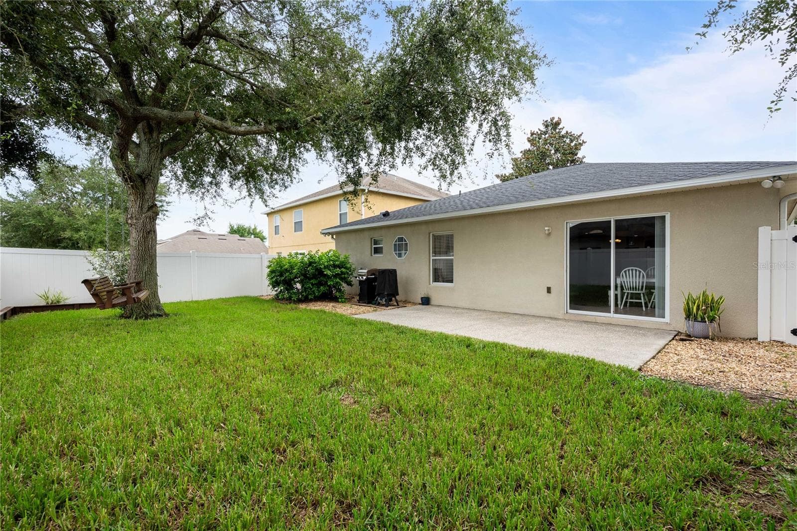 Fenced-in backyard - 14423 FINSBURY DR, SPRING HILL