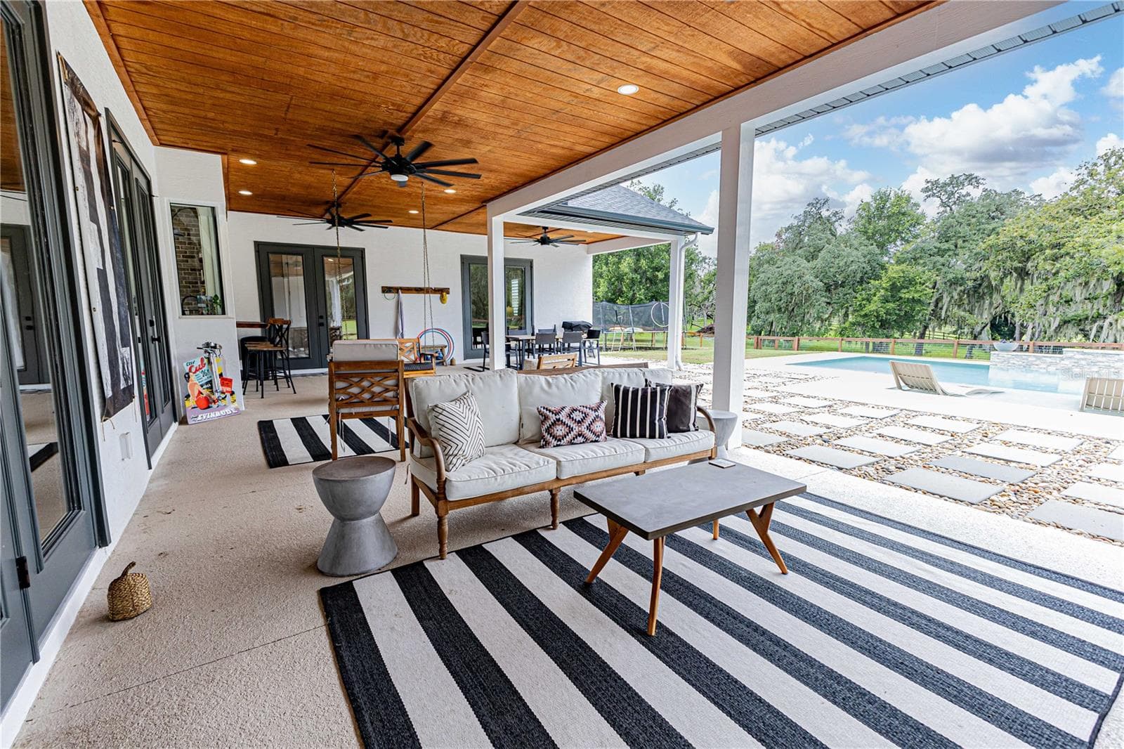 Outside entertainment area overlooking the pool - 8818 SW 73RD PATH, BUSHNELL