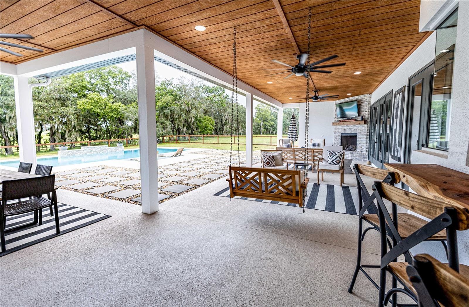 Outside entertainment area overlooking the pool - 8818 SW 73RD PATH, BUSHNELL