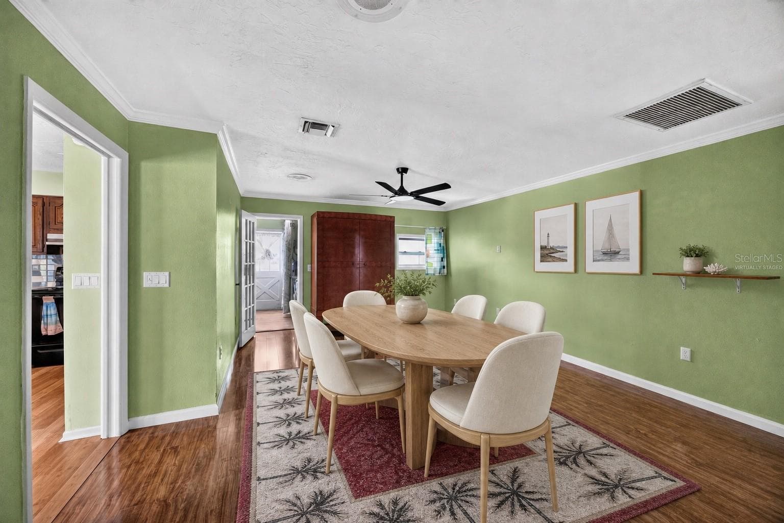 Virtually staged - Formal dining room beside the kitchen. - 1305 GREENFIELD CIR, VENICE