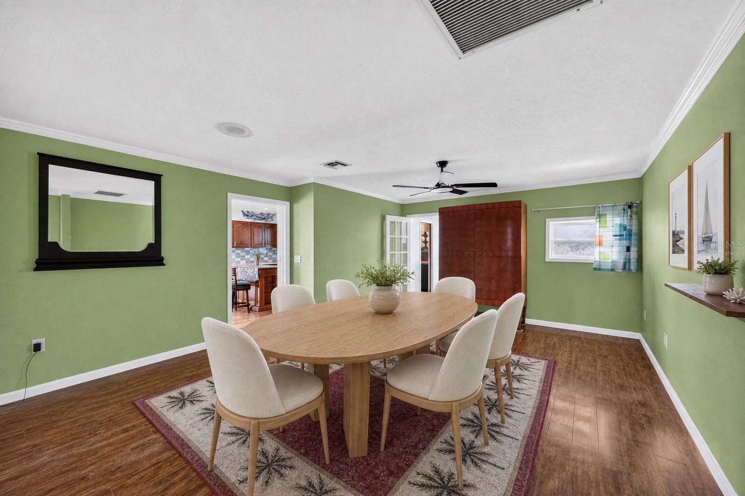 Virtually staged - Dining room with coastal-style furnishings. - 1305 GREENFIELD CIR, VENICE