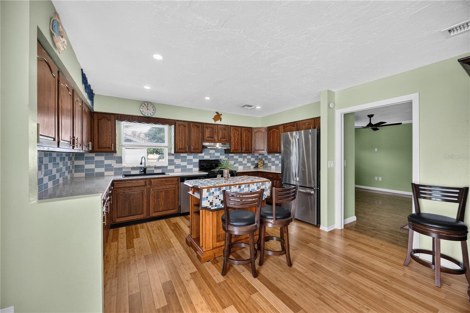 Spacious kitchen with center island and storage. - 1305 GREENFIELD CIR, VENICE