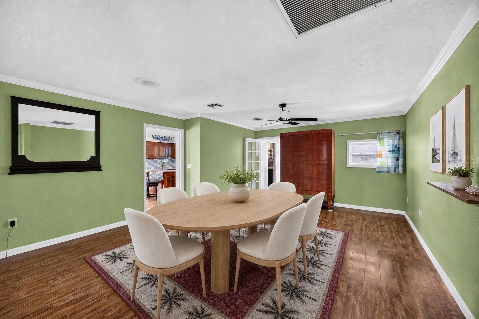 Virtually staged - Dining room located off the kitchen. - 1305 GREENFIELD CIR, VENICE