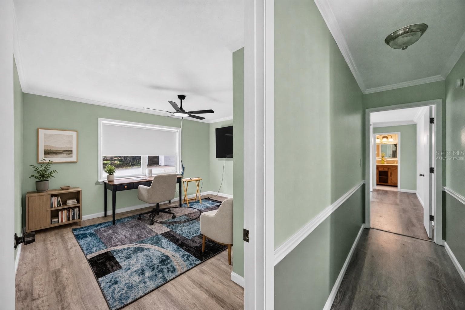 Virtually staged - Home office with desk and guest seating. - 1305 GREENFIELD CIR, VENICE
