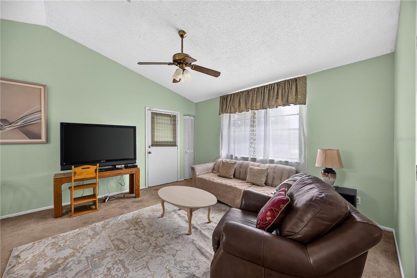 Comfortable den with TV and natural light. - 1305 GREENFIELD CIR, VENICE
