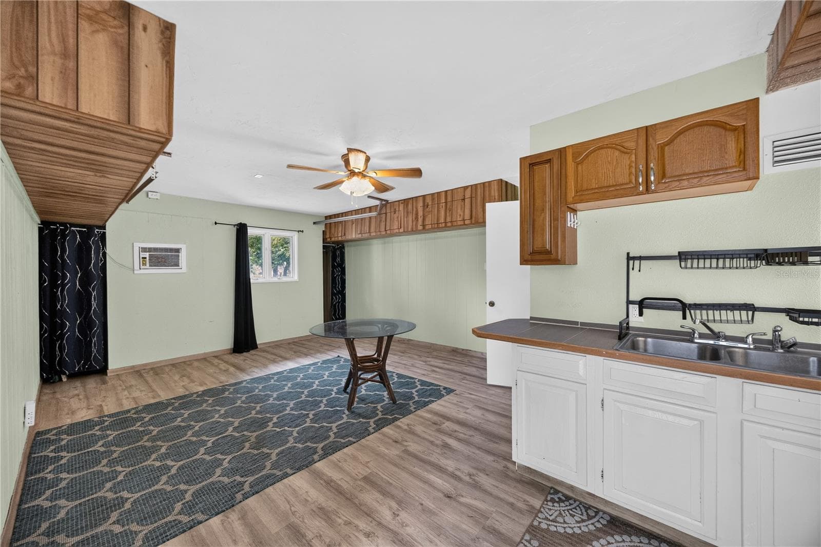 Downstairs studio with kitchenette and dining space. - 1305 GREENFIELD CIR, VENICE