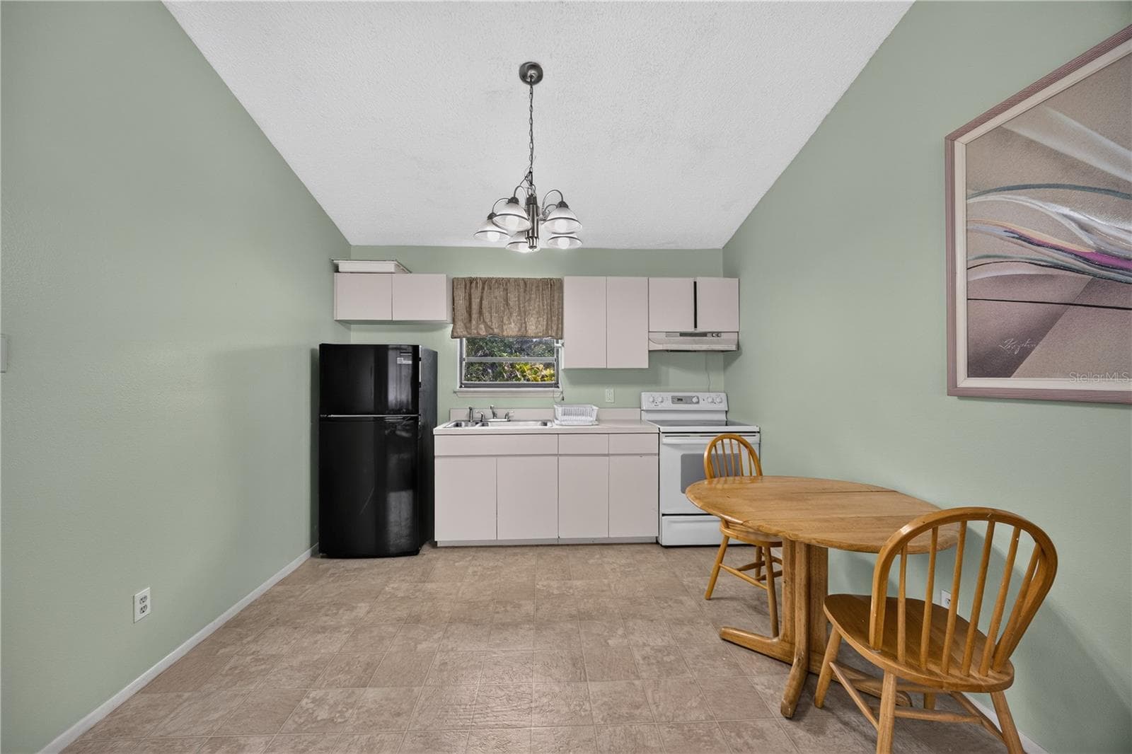 Upstairs kitchenette and dining area. - 1305 GREENFIELD CIR, VENICE