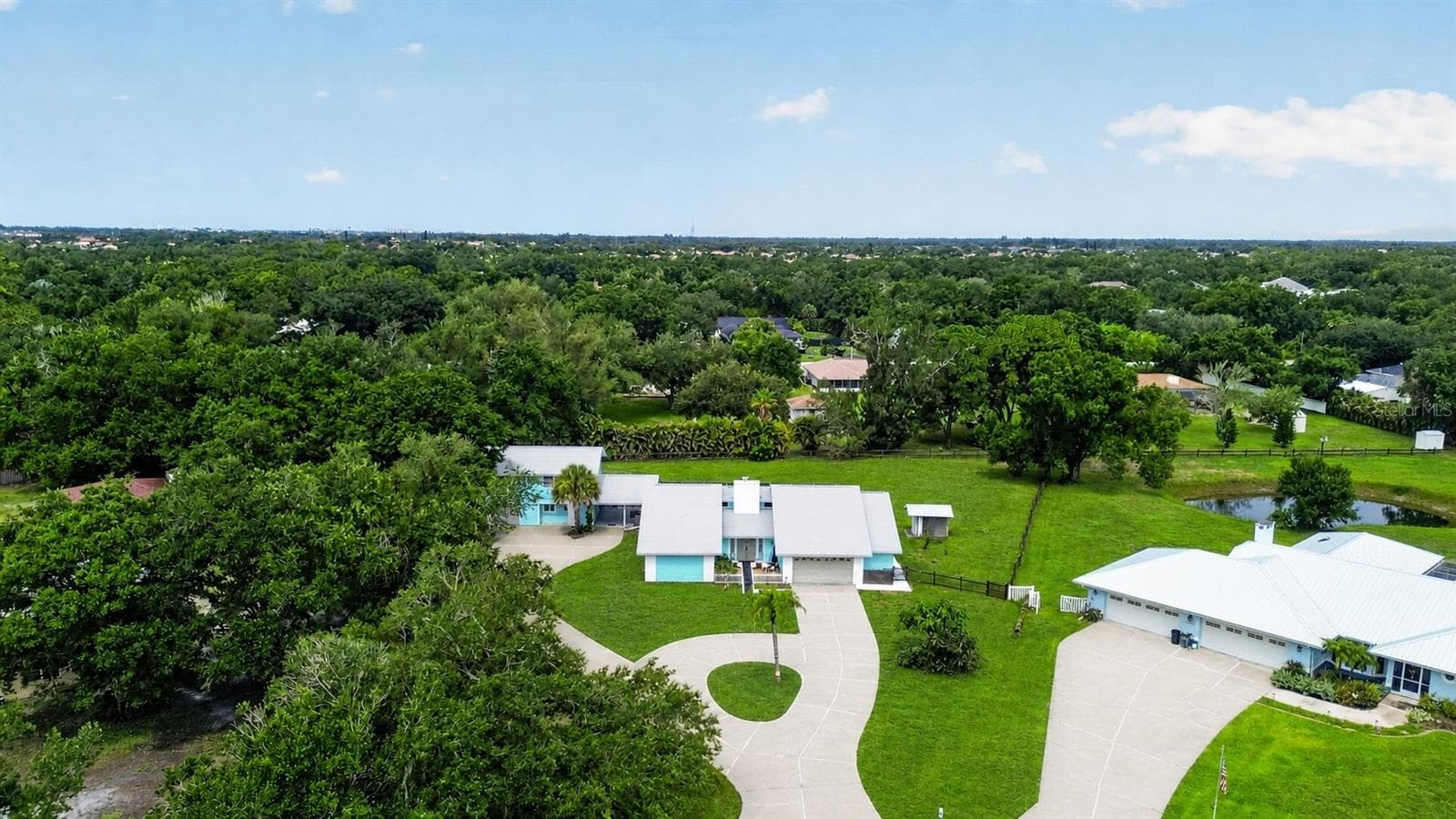 Aerial view of the property and neighborhood. - 1305 GREENFIELD CIR, VENICE